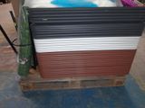 a lot of different colors of plastic sheets on a pallet