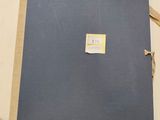 a blue book with a label on it sitting on a table
