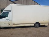 an image of a white truck parked in front of a building