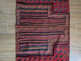 a close up of a rug on a wooden floor next to a wall