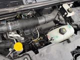 a picture of a car engine with its hood open