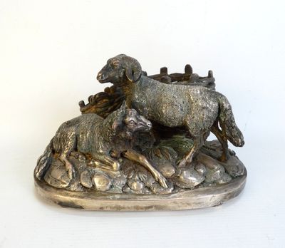 a statue of a horse and a dog running on a hill