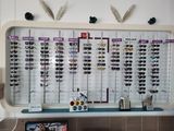 many glasses on the wall in the store