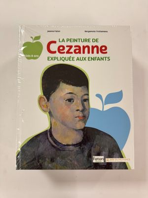 une image représentant un livre sur lequel figure l'illustration d'un garçon devant une pomme