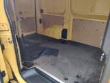 a yellow van that is parked in a lot