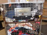 a metal cart with a bunch of clothes in it