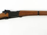 a wooden rifle with a black handle and a wooden barrel