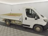 a white truck that is parked in a garage