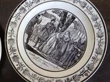 a plate with a drawing on it sitting on a table