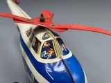 a blue and white toy airplane with a red propeller