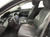 the interior of a car with a black leather seat and a steering wheel