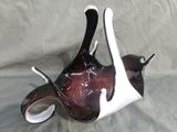 a glass vase with a black and white design on it
