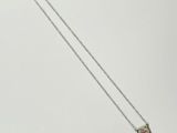 sterling silver necklace with a red stone and a pearl pendant