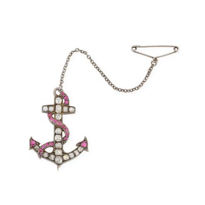 a close up of a necklace with an anchor on it