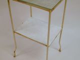 a small glass table with a shelf on it
