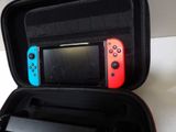 two nintendo wii controllers in a case on a table