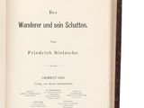 an open book on a white surface with a red border