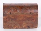 an old wooden box with a floral design on the front