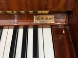 a close up of a piano with a label on it