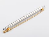 a close up of a pen on a white surface with a white background