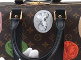 louis vuitton mickey mouse handbag with mickey mouse stickers on it