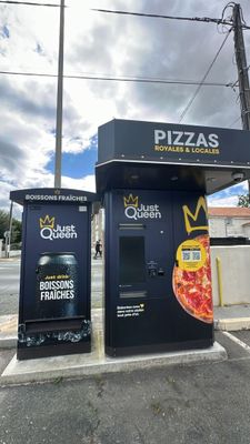 two vending machines on the side of the road