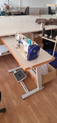 a sewing machine sitting on a table in a room