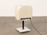 an image of a white television sitting on top of a metal stand