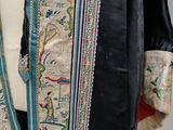 a close up of a person wearing a blue and white robe