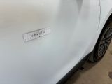 a white car that has a sticker on the side of it