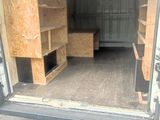 a picture of the inside of a moving truck with the door open