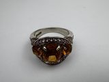 a close up of a ring on a white surface
