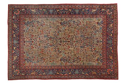 un tapis persan antique avec un motif floral sur fond blanc