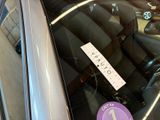 a sticker on the windshield of a car with a sticker attached to it
