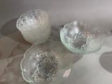 three glass bowls sitting on a counter top