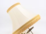 a lamp that is sitting on a stand on a table