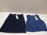 two pairs of denim skirts are on a white table