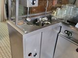 a kitchen with stainless steel appliances in it