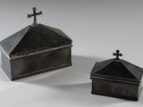 pair of silverplated boxes with crosses on top of them