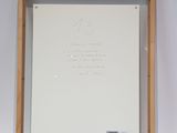 an image of a picture of a whiteboard in a wooden frame