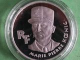 silver coin with a portrait of a man in a top hat