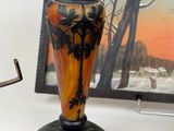 a lamp that is sitting on a table next to a picture