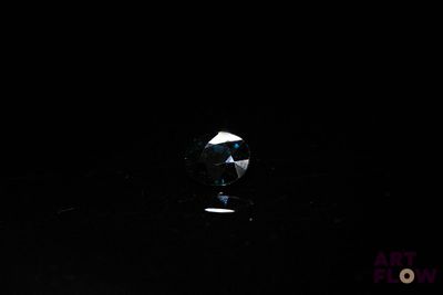 an image of a glass of wine in the dark
