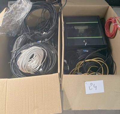 two boxes of wires and wires are sitting on a table