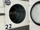 a photo of a washer and a dryer in a public washroom