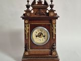 a wooden clock that is sitting on a table