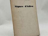 a close up of a book on a white surface with a white background