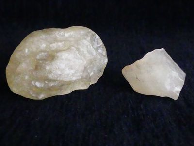 two pieces of white quartz sitting next to each other