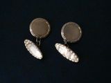 silver plated earrings with mother of pearl in the middle