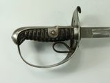 a close up of a knife on a white surface